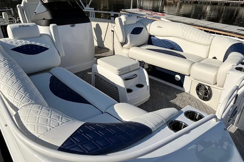 Slide: The Image of Luxurious seating on 2026 JC Sporttoon 26TT boat with elegant blue and white upholstery. - 12