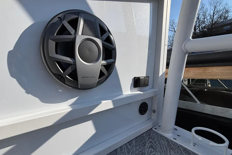 Slide: The Image of 2026 JC Sporttoon 26TT boat speaker and control panel detail. - 21