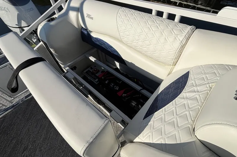 Slide: The Image of White leather seating with storage compartment on a 2026 JC Sporttoon 26TT boat. - 25