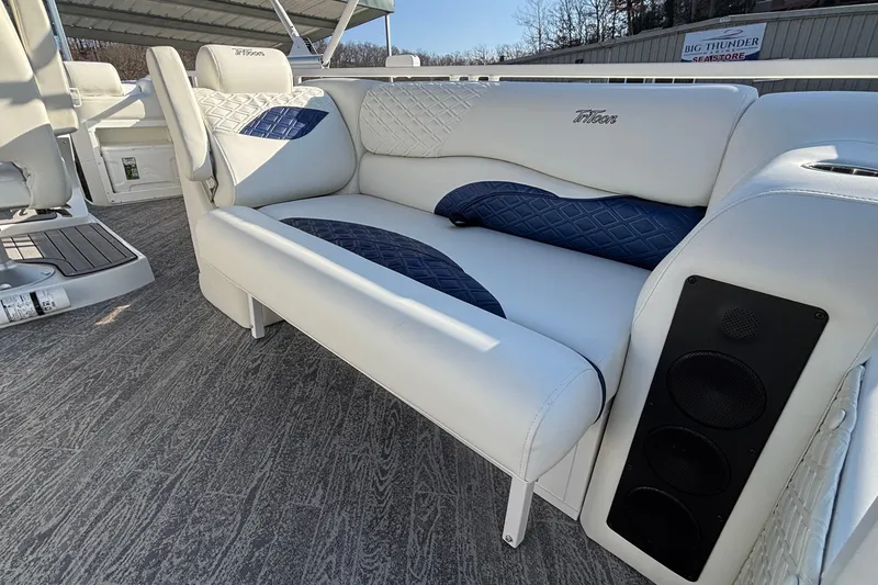 Slide: The Image of Luxurious seating on 2026 JC Sporttoon 26TT boat with stylish white and blue upholstery. - 24