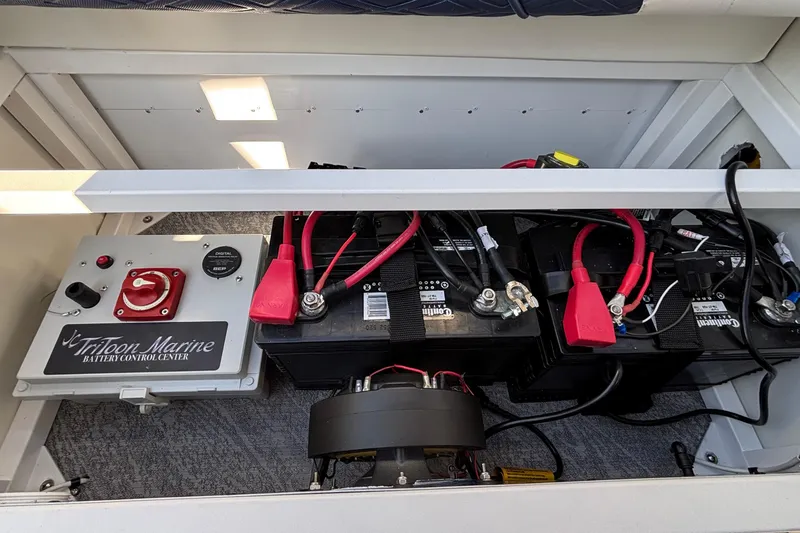 Slide: The Image of Battery compartment of 2026 JC Sporttoon 26TT with marine control center. - 26
