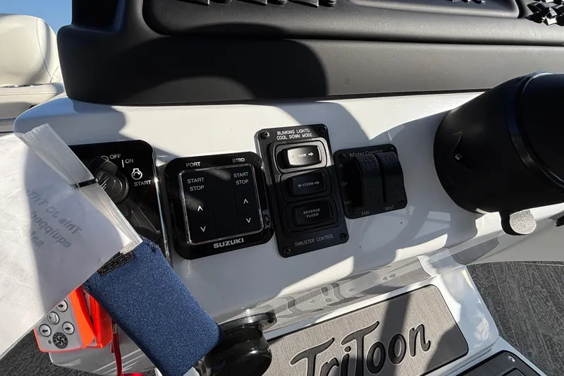 Slide: The Image of Control panel of 2026 JC Sporttoon 26TT boat with various switches and buttons. - 41