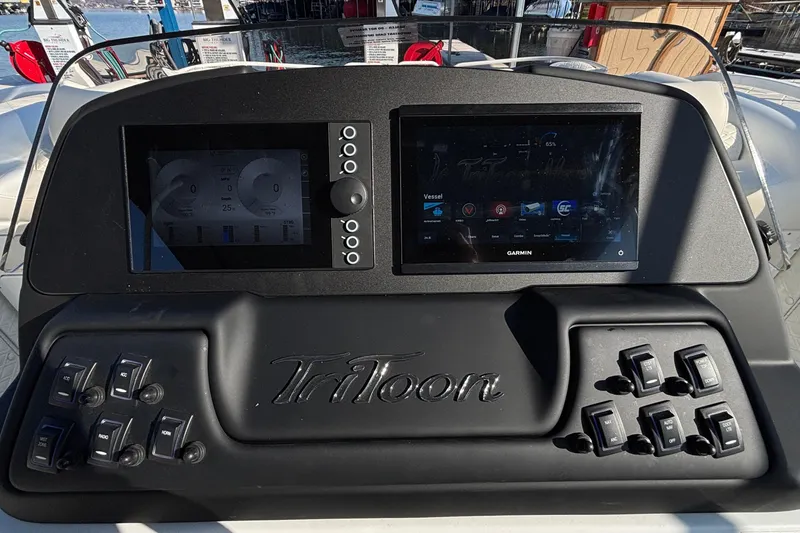 Slide: The Image of Control panel of 2026 JC Sporttoon 26TT boat with digital displays and switches. - 42
