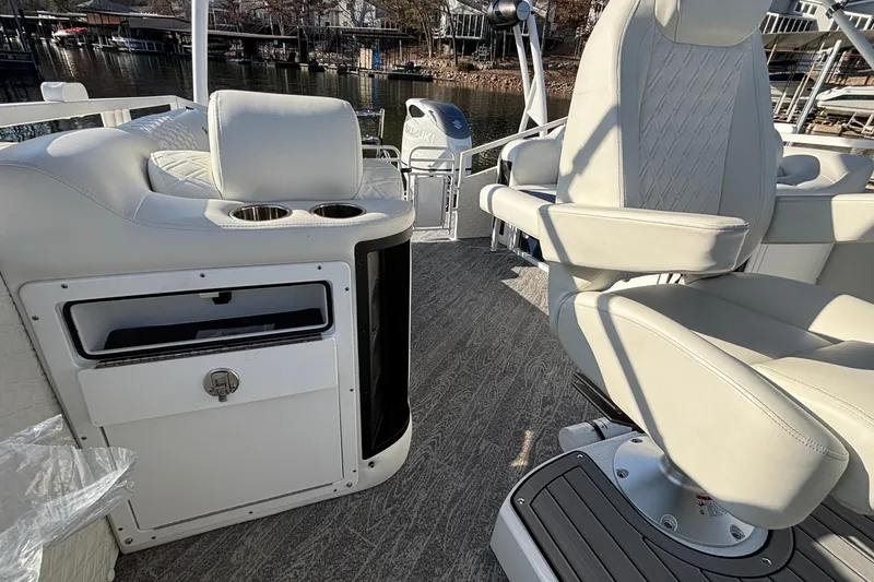 Slide: The Image of Luxury interior of 2026 JC Sporttoon 26TT boat with plush seating and cup holders. - 45