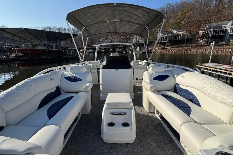 Slide: The Image of Luxurious 2026 JC Sporttoon 26TT pontoon boat with spacious seating and canopy on a serene lake. - 52