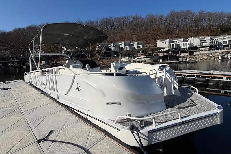 Slide: The Image of 2026 JC Sporttoon 26TT pontoon boat docked at marina with canopy. - 9