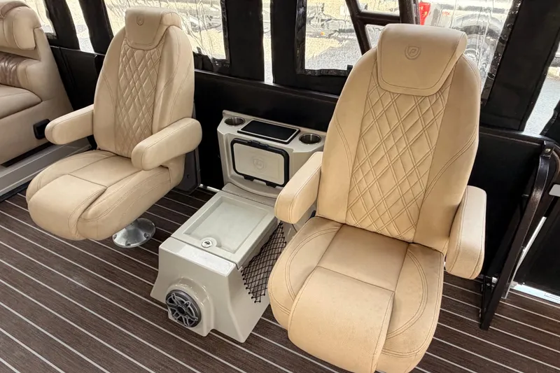 Slide: The Image of Luxurious seating on 2021 Premier 310 Boundary Waters Rev Top Deck boat interior. - 11