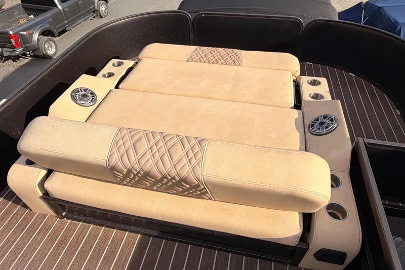 Slide: The Image of 2021 Premier 310 Boundary Waters Rev Top Deck with beige seating and cup holders. - 15