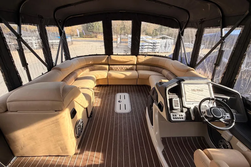 Slide: The Image of Luxurious interior of 2021 Premier 310 Boundary Waters pontoon boat with plush seating and helm. - 4