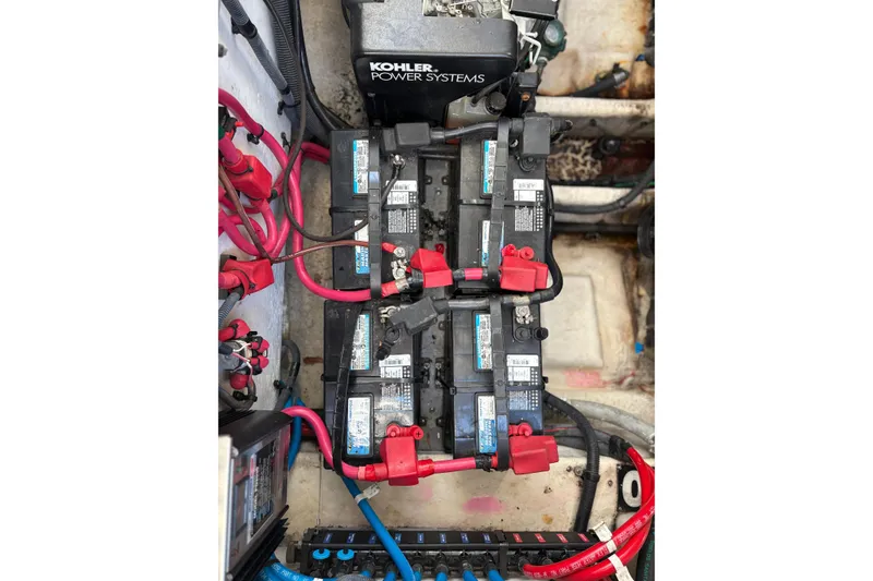 Slide: The Image of Engine compartment of a 2005 Sea Ray 300 Sundancer with Kohler power systems and batteries. - 15