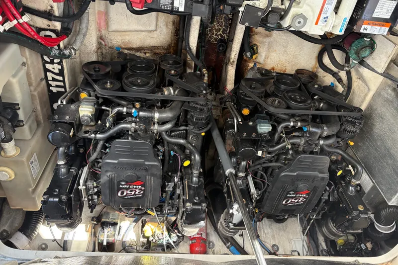 Slide: The Image of Twin MerCruiser engines in a 2005 Sea Ray 300 Sundancer boat engine compartment. - 17