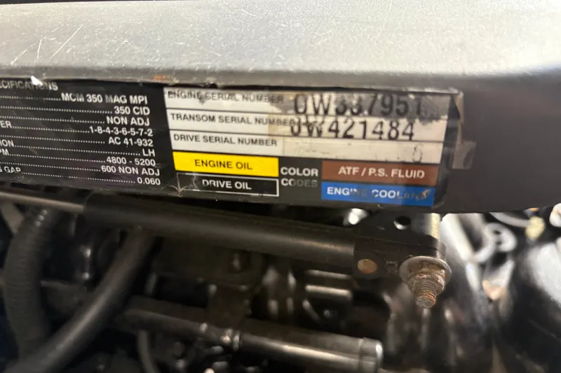 Slide: The Image of Engine specifications label on a 2005 Sea Ray 300 Sundancer boat. - 22