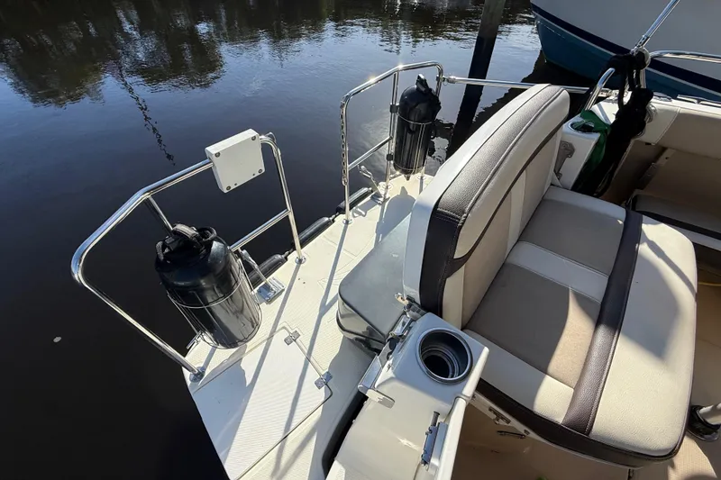 Slide: The Image of 2015 Cutwater 28 boat deck with seating and safety railings. - 10