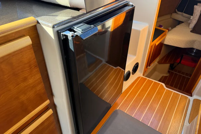 Slide: The Image of Interior of a 2015 Cutwater 28 yacht with refrigerator. - 15