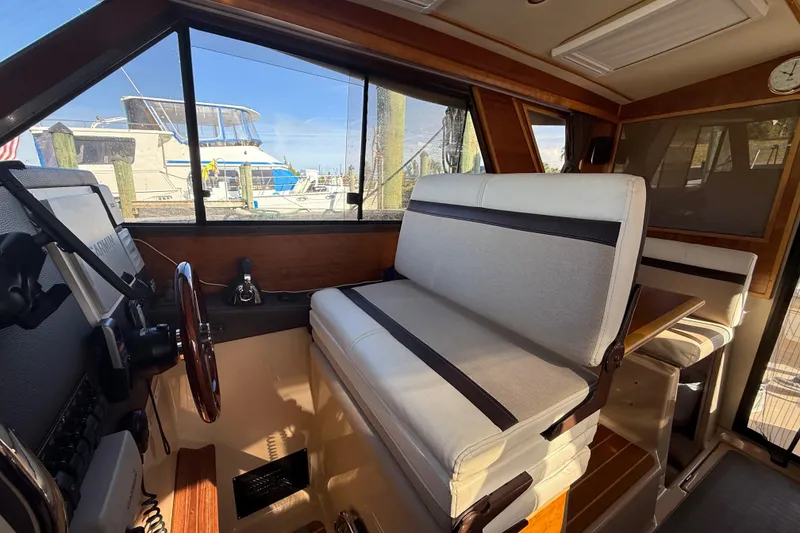 Slide: The Image of Interior of a 2015 Cutwater 28 boat with seating and helm station. - 22