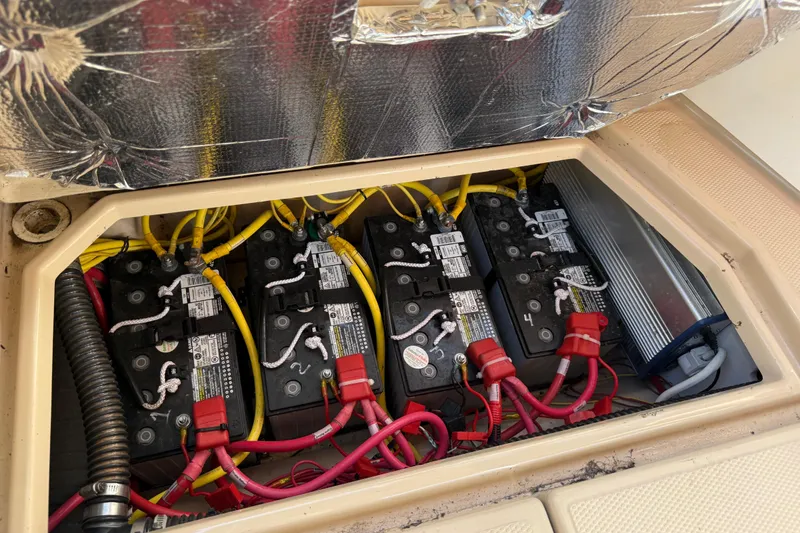 Slide: The Image of Battery compartment of a 2015 Cutwater 28 boat with multiple connected batteries. - 25