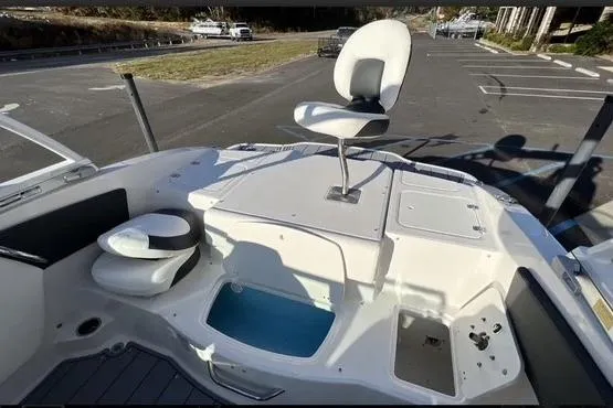 Slide: The Image of 2023 Chaparral 210 SSi boat interior with seating and storage compartments. - 23