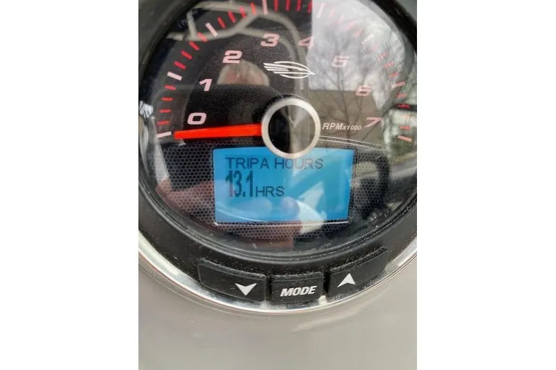 Slide: The Image of Close-up of 2023 Chaparral 210 SSi tachometer displaying 13.1 trip hours. - 24
