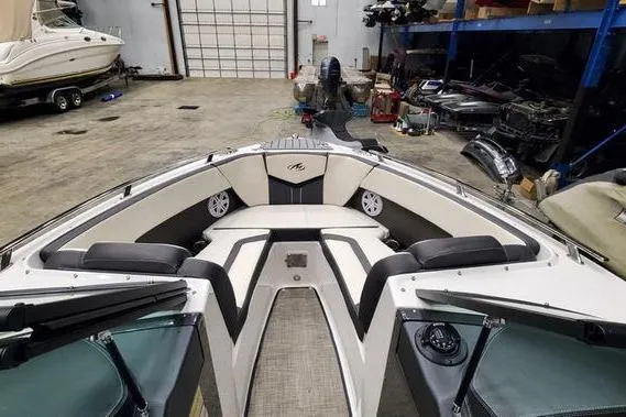 Slide: The Image of 2019 Monterey 218SS Super Sport boat interior in a spacious garage setting. - 11