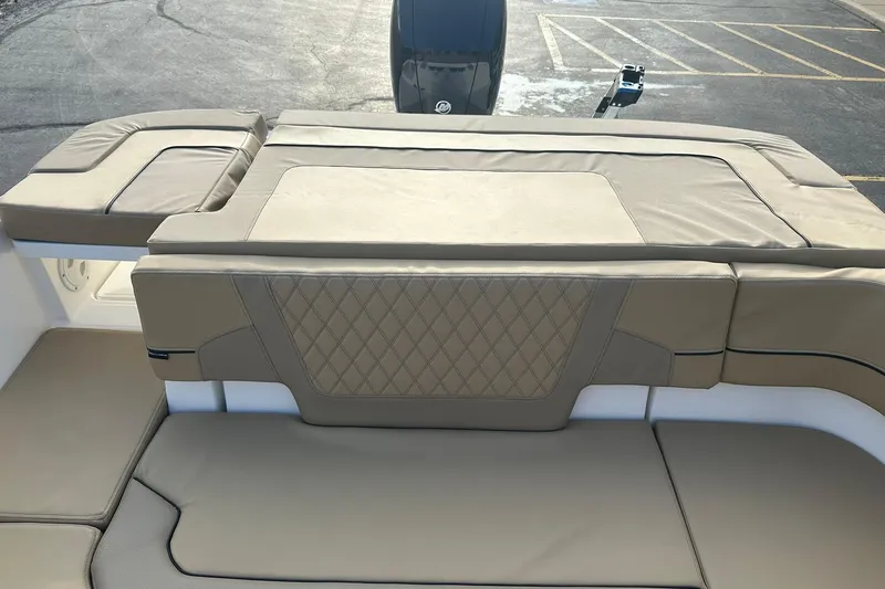 Slide: The Image of 2026 Bayliner VR6 Bowrider OB with tan cushioned seating and diamond-patterned upholstery. - 10