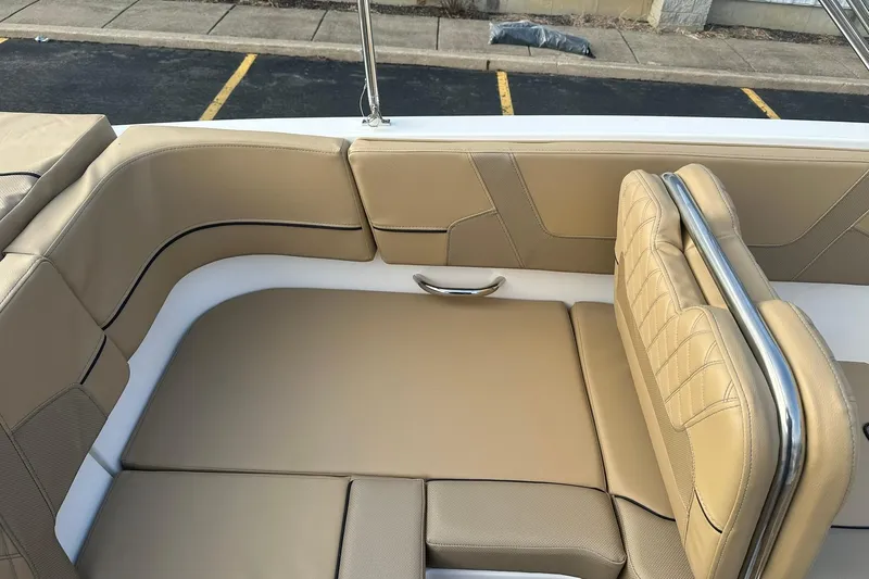 Slide: The Image of 2026 Bayliner VR6 Bowrider OB interior with tan leather seating and stainless steel accents. - 11