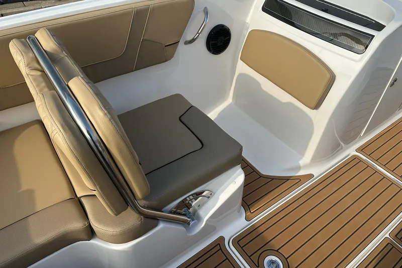 Slide: The Image of 2026 Bayliner VR6 Bowrider OB interior with tan seating and teak-style flooring. - 13