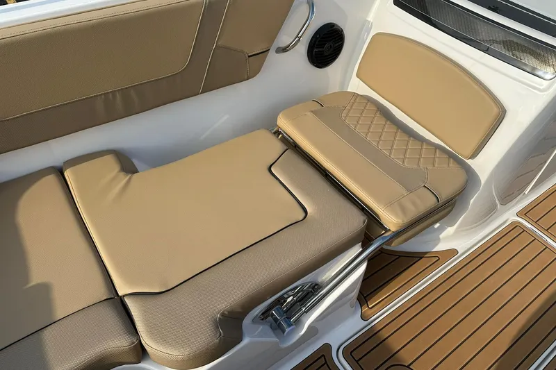 Slide: The Image of 2026 Bayliner VR6 Bowrider OB interior with tan seating and teak-style flooring. - 15
