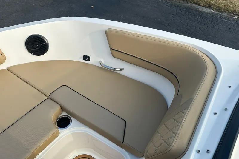 Slide: The Image of 2026 Bayliner VR6 Bowrider OB interior with tan seating and speaker detail. - 18
