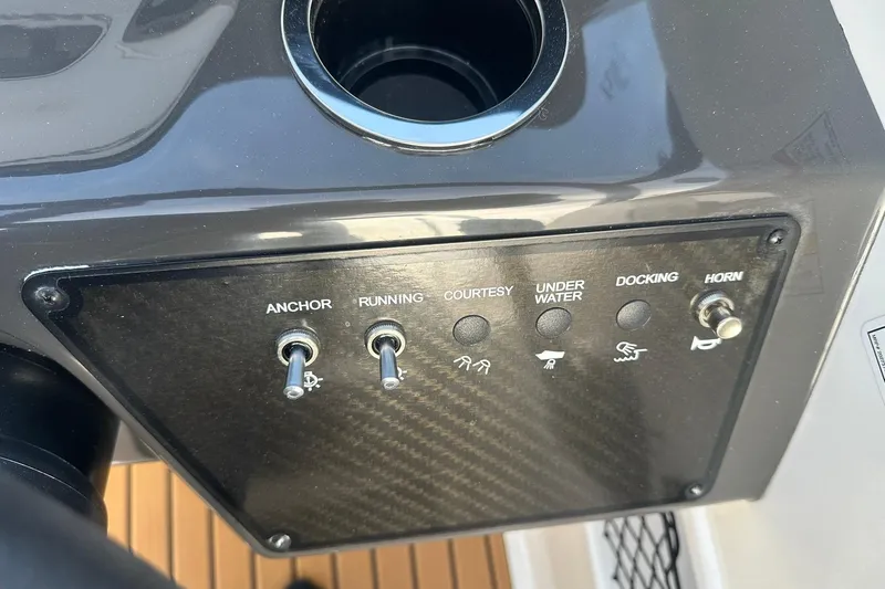 Slide: The Image of Control panel of 2026 Bayliner VR6 Bowrider OB with switches for anchor, running, and horn. - 22