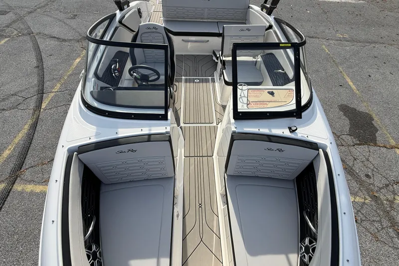 Slide: The Image of 2026 Sea Ray SPX 210 Outboard boat interior with open cockpit and seating. - 10