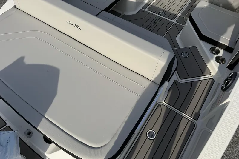 Slide: The Image of 2026 Sea Ray SPX 210 Outboard boat interior with sleek seating and modern design. - 2