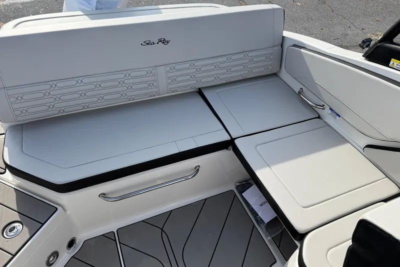 Slide: The Image of 2026 Sea Ray SPX 210 Outboard boat interior seating with elegant design and stitching. - 5