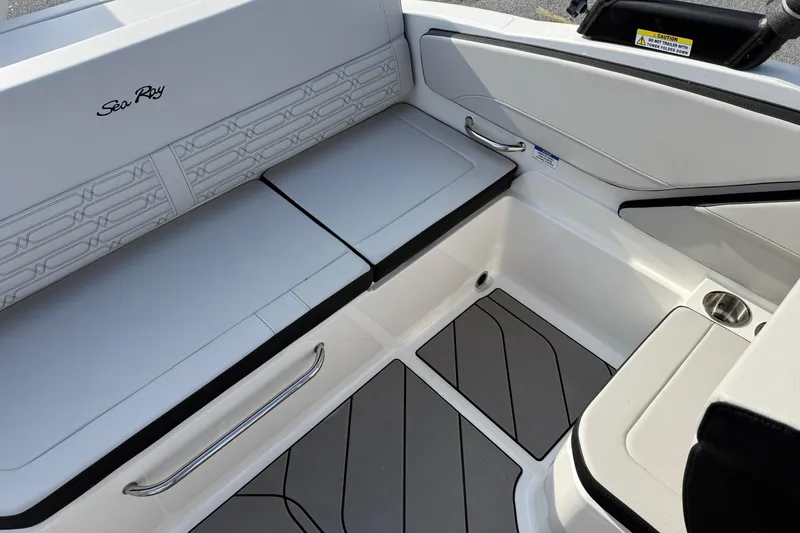 Slide: The Image of 2026 Sea Ray SPX 210 Outboard boat interior with sleek seating and modern design. - 6