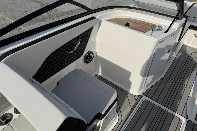 Slide: The Image of 2026 Sea Ray SPX 210 Outboard boat interior with seating and control panel. - 7