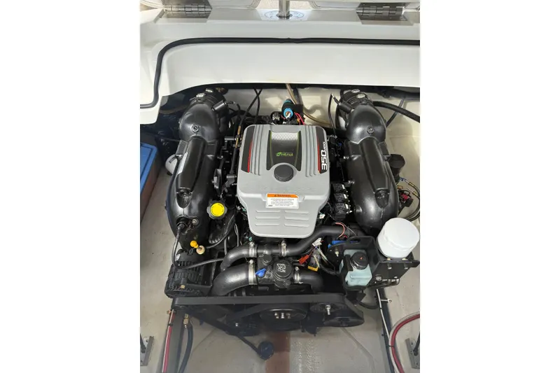 Slide: The Image of 2013 Cobalt 232 boat engine, featuring a powerful 350 MAG motor. - 21