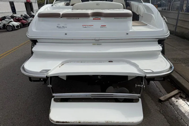 Slide: The Image of Rear view of a 2013 Cobalt 232 boat with swim platform and seating. - 26