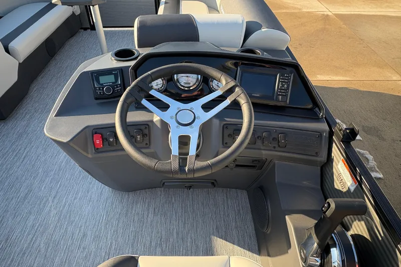 Slide: The Image of Helm of 2026 Bennington 22 S-One Swingback with steering wheel and control panel. - 13