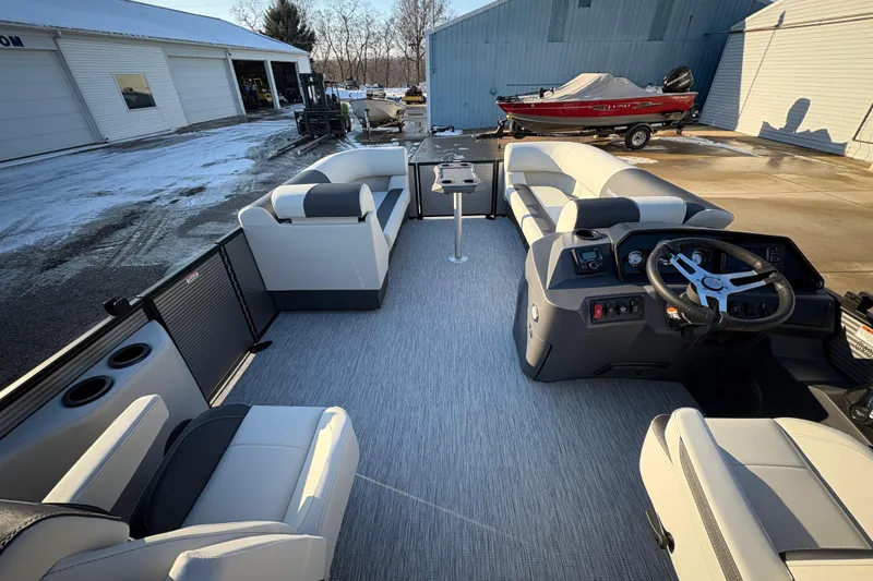 Slide: The Image of 2026 Bennington 22 S-One Swingback pontoon boat interior with modern seating and steering console. - 19