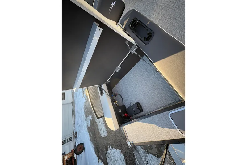 Slide: The Image of 2026 Bennington 22 S-One Swingback interior with seating and storage compartments. - 22