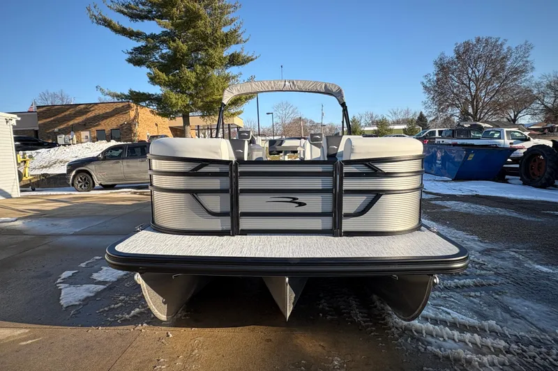 Slide: The Image of 2026 Bennington 22 S-One Swingback pontoon boat in a snowy outdoor setting. - 4