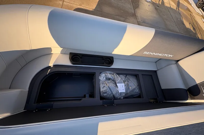 Slide: The Image of Bennington 22 S-One Swingback 2026 boat seat with storage compartment open. - 8
