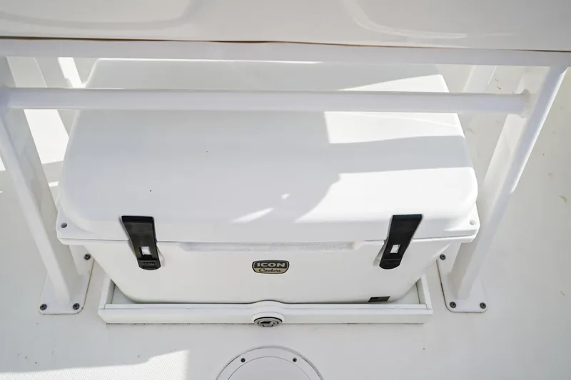 Slide: The Image of White Icon cooler on 2021 Edgewater 230CC boat deck. - 11