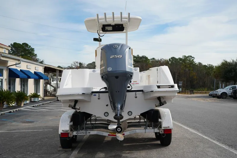 Slide: The Image of 2021 Edgewater 230CC boat on trailer with Yamaha 250 outboard motor. - 2