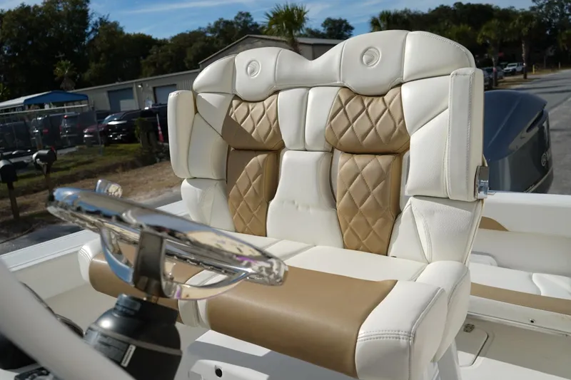 Slide: The Image of Luxurious seating on a 2021 Edgewater 230CC boat, featuring diamond-stitched upholstery. - 4
