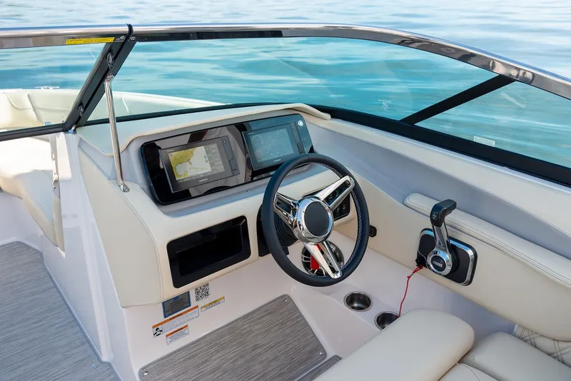 Slide: The Image of Manufacturer Provided Image: 2026 Regal LS6 boat cockpit with modern steering and navigation system. - 10