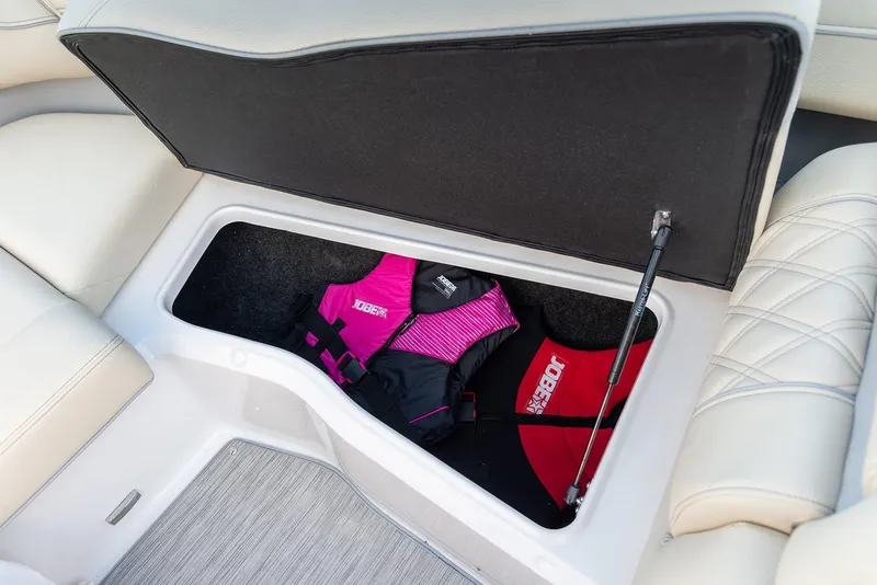 Slide: The Image of Manufacturer Provided Image: 2026 Regal LS6 boat storage compartment with life jackets inside. - 14