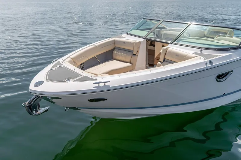 Slide: The Image of Manufacturer Provided Image: 2026 Regal LS6 boat on calm water, featuring sleek design and spacious seating. - 7