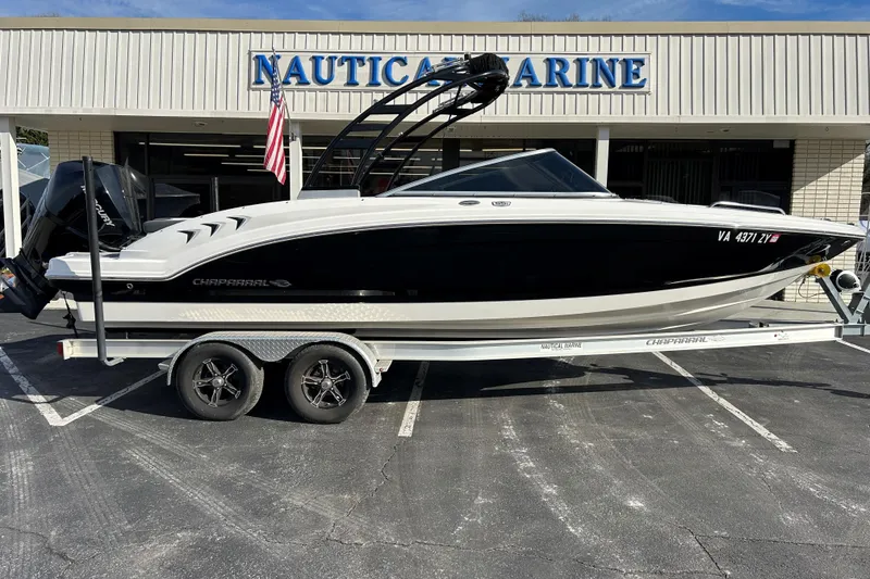 The Image of 2022 Chaparral 23 SSi OB boat on trailer outside Nautic Marine dealership. - 0