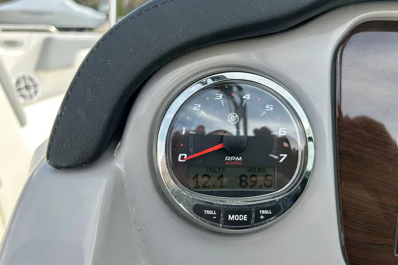 Slide: The Image of Close-up of 2022 Chaparral 23 SSi OB boat tachometer showing RPM, volts, and hours. - 16