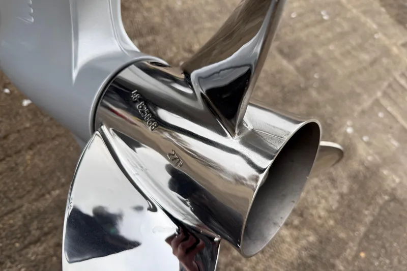 Slide: The Image of 2018 Blazer 625 Pro Elite boat on trailer by a lake, overcast sky. - 11